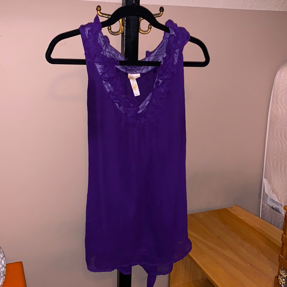 Purple shirt with ruffled collar